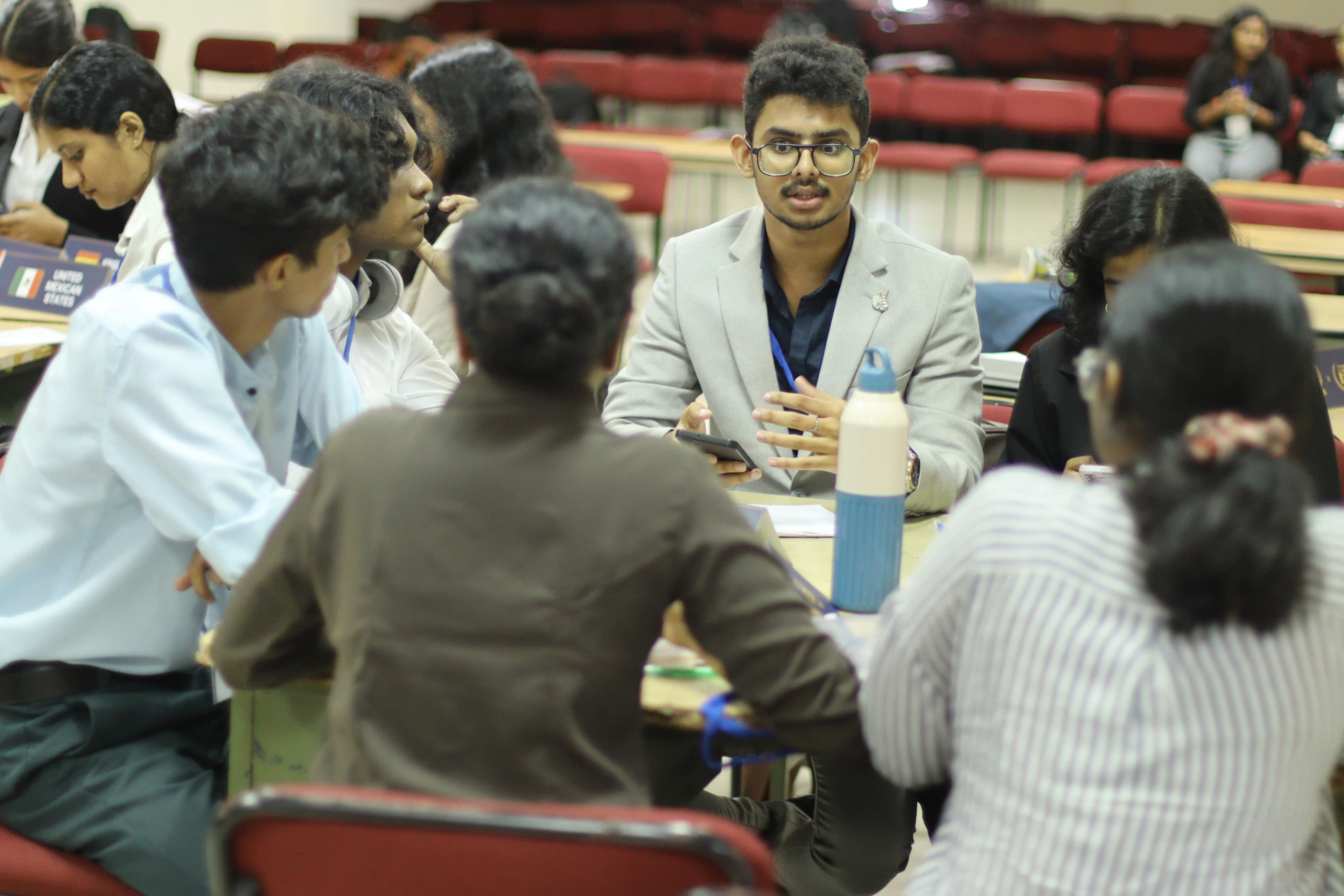 Delegates collaborating during unmoderated caucus